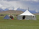 Tibet Kailash 04 Saga to Kailash 16 Paryang Nomad Tent with Nepal Mountains To the south of the Tibetan town of Paryang (4590m), a nomad tent has a great view of the peaks of Nepals Shey Phoksumdo  National Park in the area called Dolpo. Kanjiroba (6883m) is the highest peak in the park.